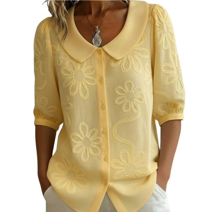 Régine - Blouse élégante à détails floraux