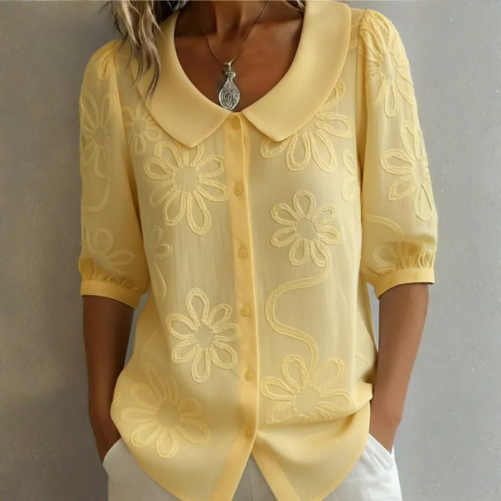 Régine - Blouse élégante à détails floraux