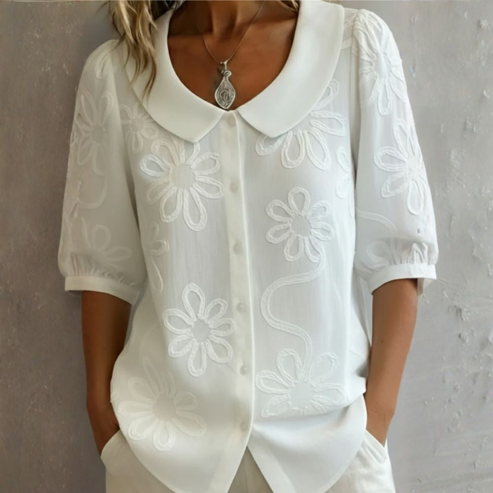 Régine - Blouse élégante à détails floraux